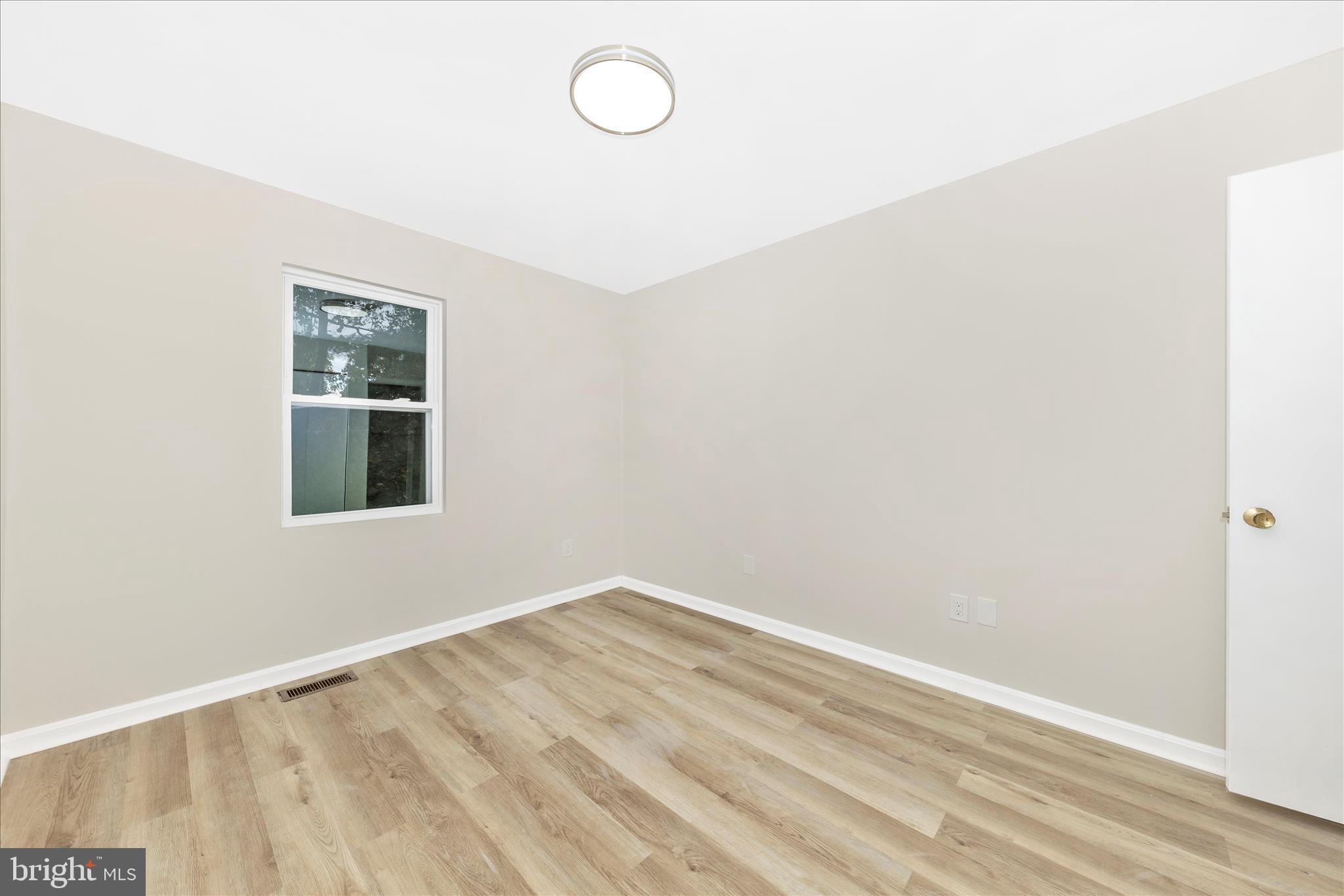 1 Kinsman View Circle Silver Spring, MD 20901 - Photo 23 of 52 an empty room with a window