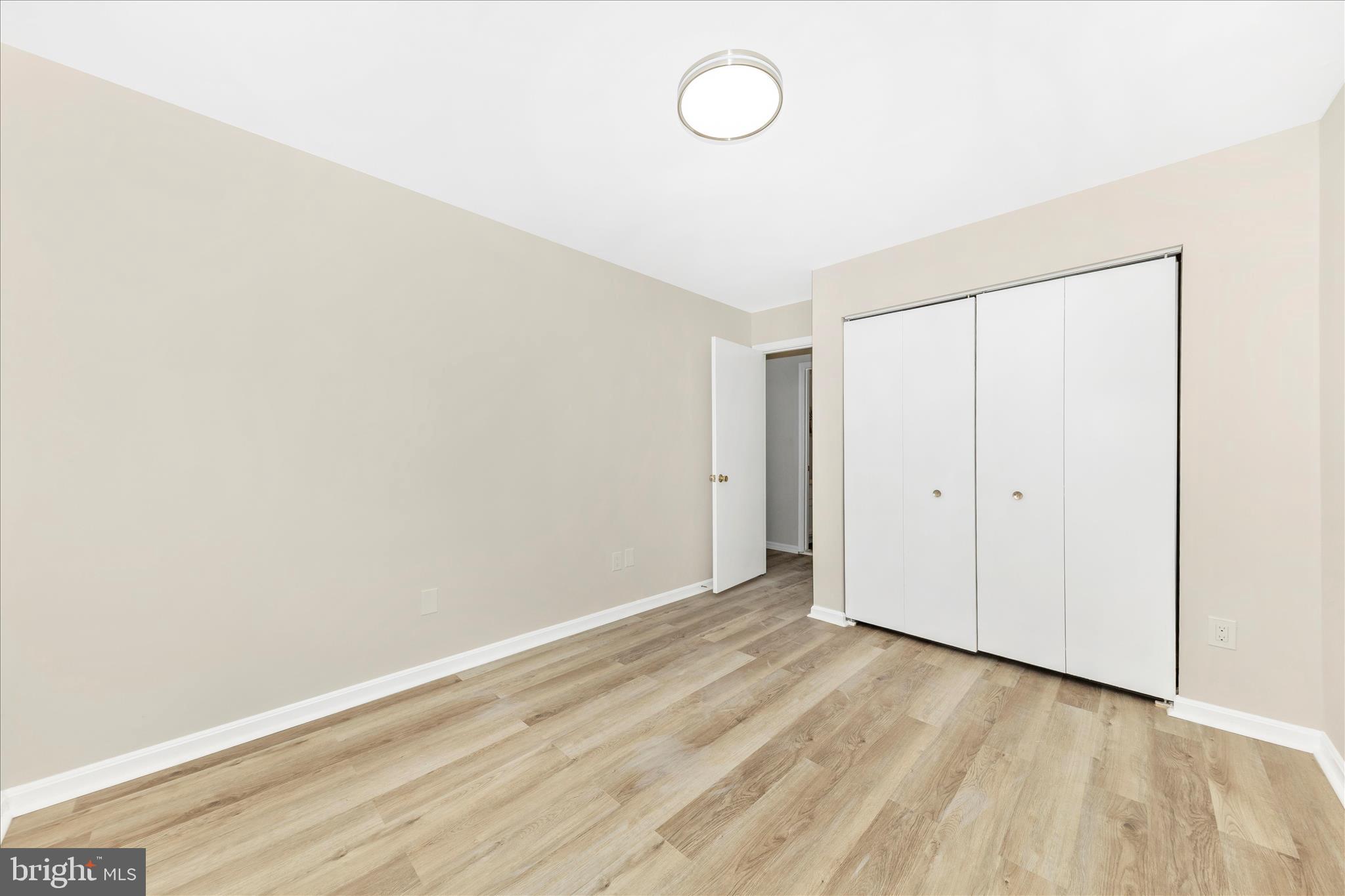 1 Kinsman View Circle Silver Spring, MD 20901 - Photo 24 of 52 a view of a room with wooden floor