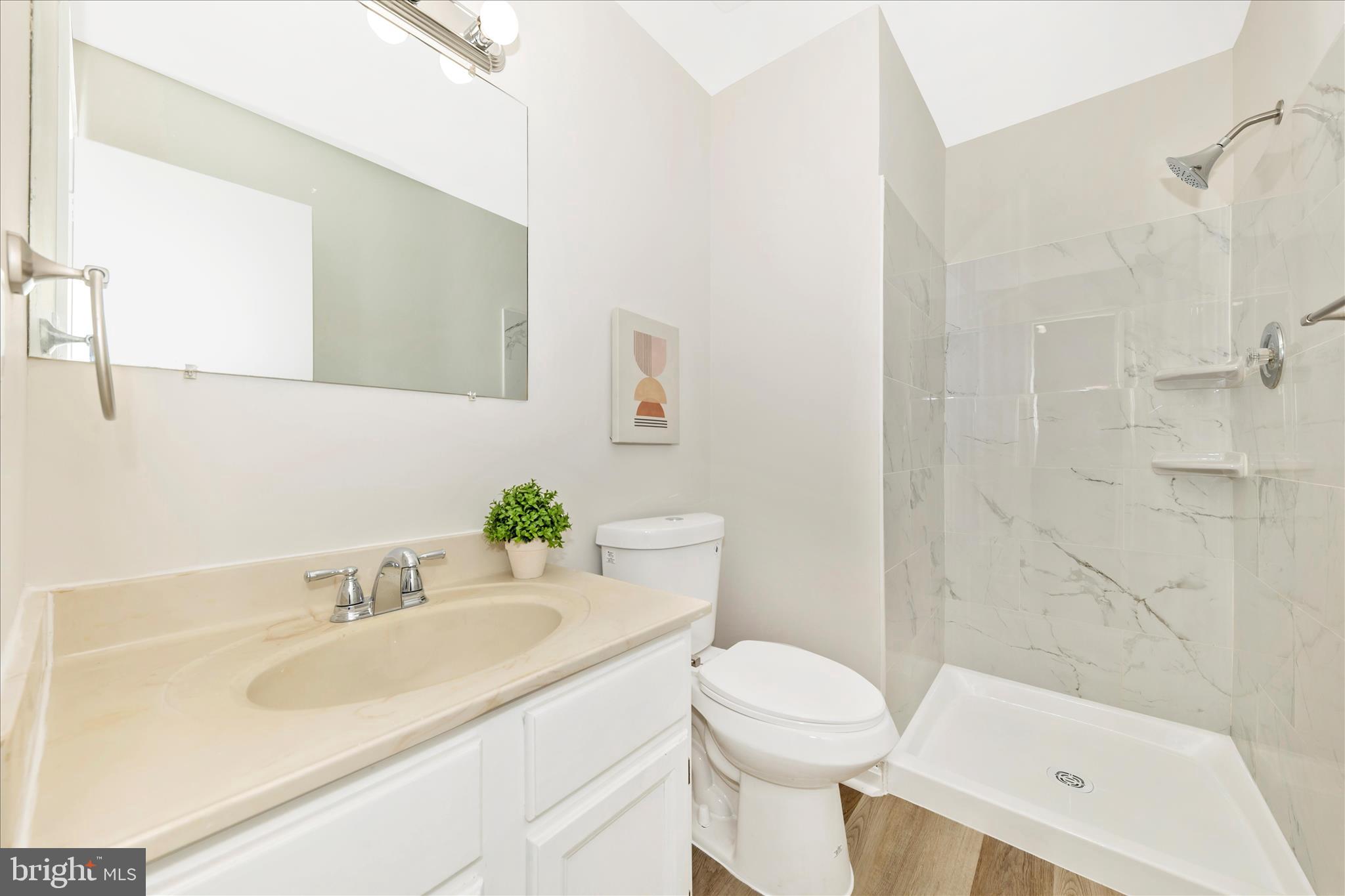 1 Kinsman View Circle Silver Spring, MD 20901 - Photo 33 of 52 a bathroom with a sink toilet and shower