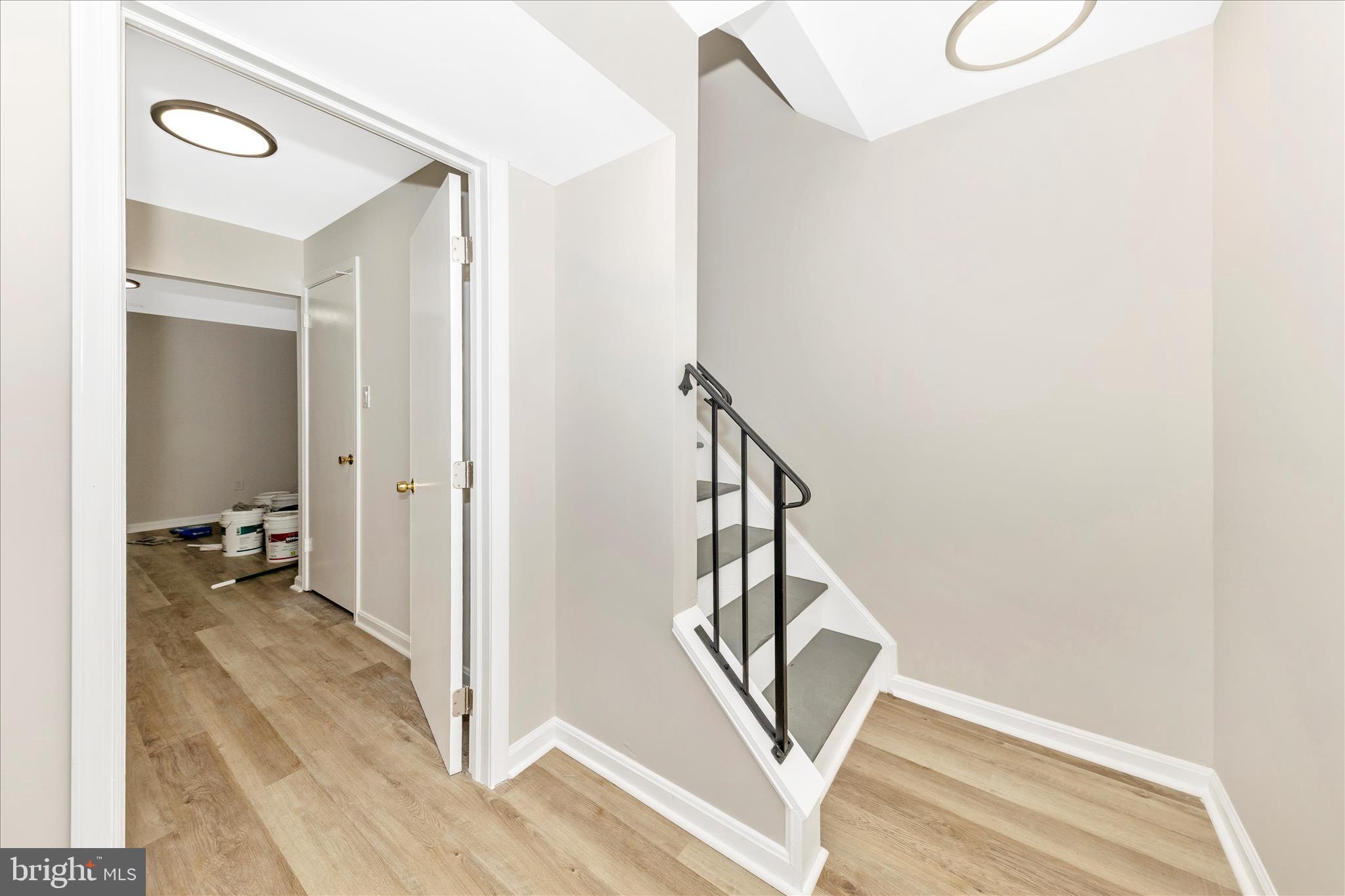 1 Kinsman View Circle Silver Spring, MD 20901 - Photo 34 of 52 a view of a hallway with wooden floor and staircase