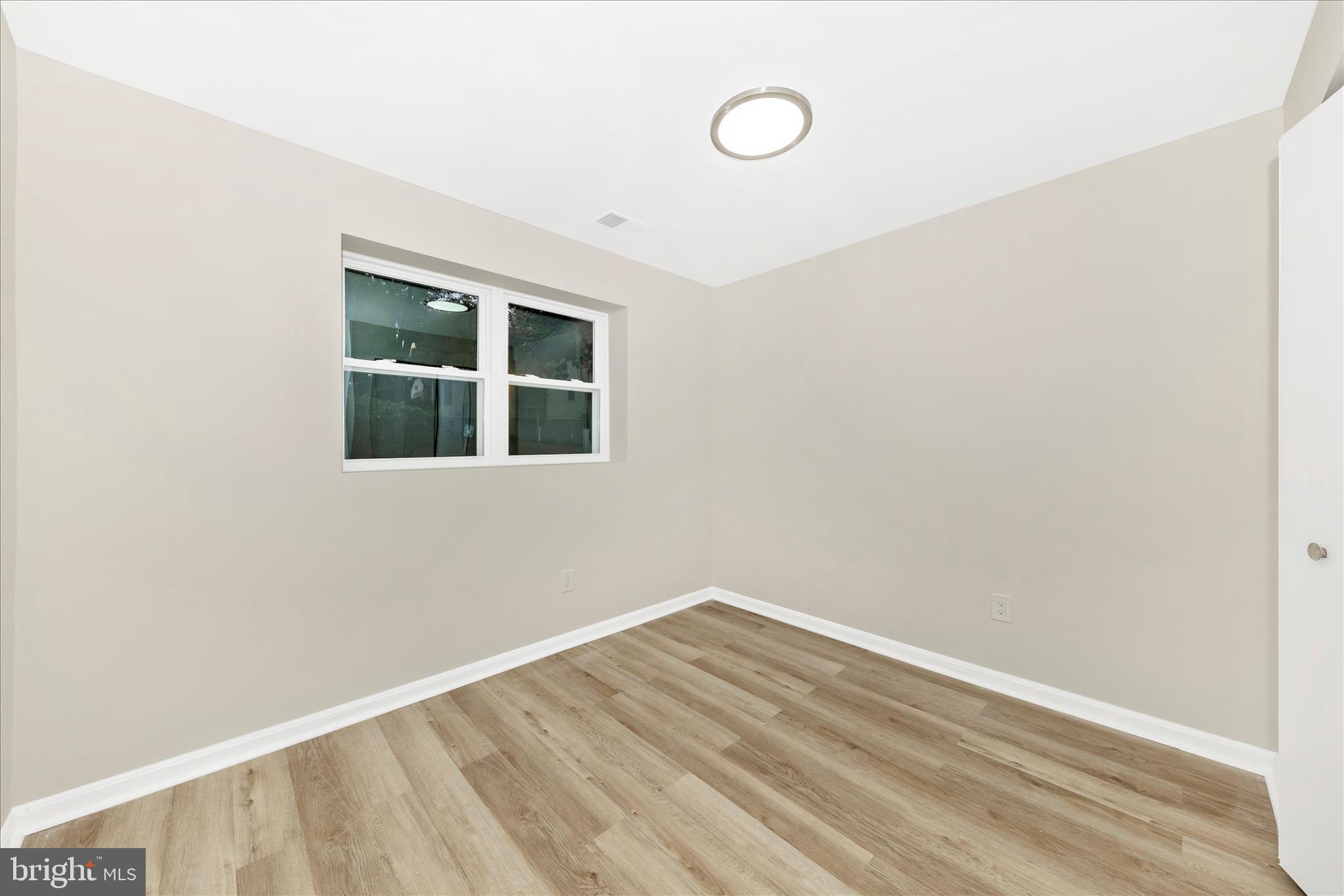 1 Kinsman View Circle Silver Spring, MD 20901 - Photo 35 of 52 a view of a room with wooden floor and fan