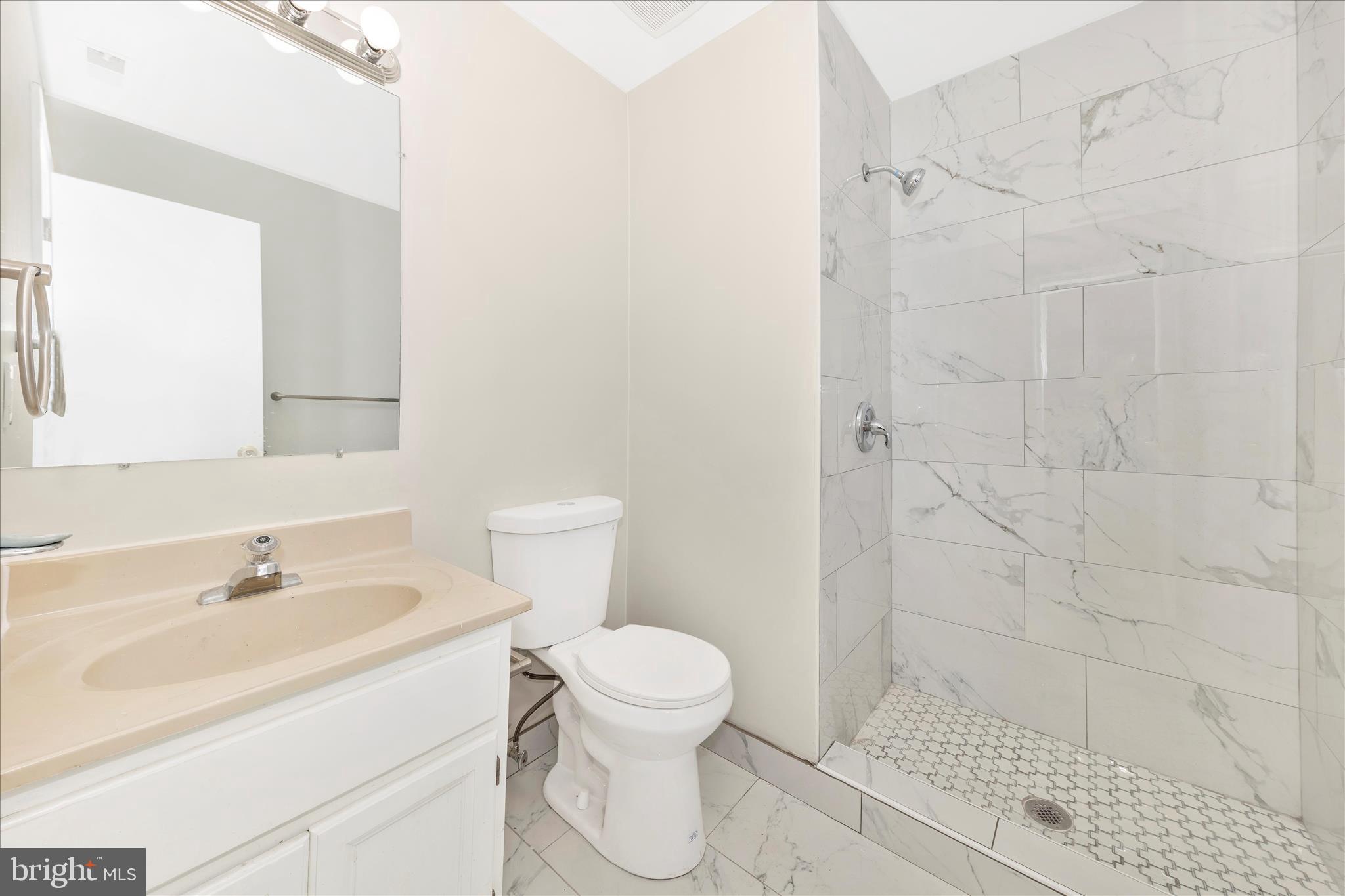 1 Kinsman View Circle Silver Spring, MD 20901 - Photo 38 of 52 a bathroom with a sink toilet and shower