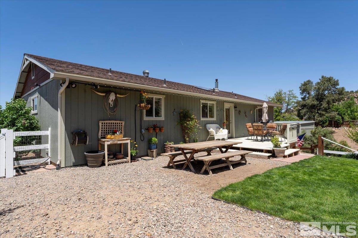 1950 Geiger Grade Road Reno, NV 89521 - Photo 22 of 32 a view of a patio with table and chairs and potted plants