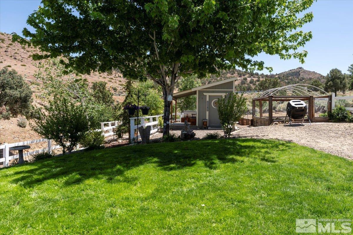 1950 Geiger Grade Road Reno, NV 89521 - Photo 23 of 32 a view of a house with a backyard