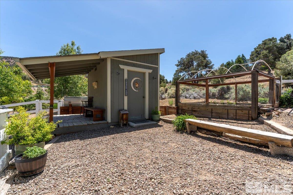1950 Geiger Grade Road Reno, NV 89521 - Photo 25 of 32 a view of a porch with a table and chairs and potted plants