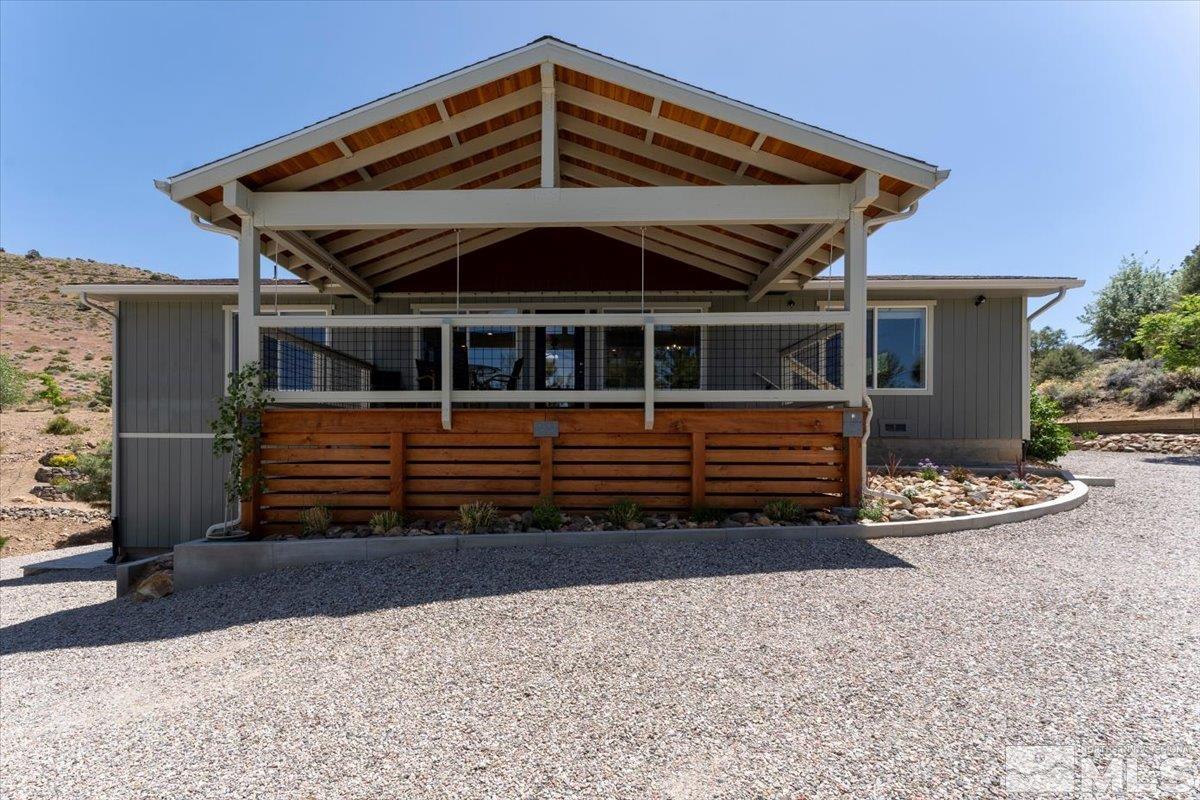 1950 Geiger Grade Road Reno, NV 89521 - Photo 4 of 32 a front view of a house with garden