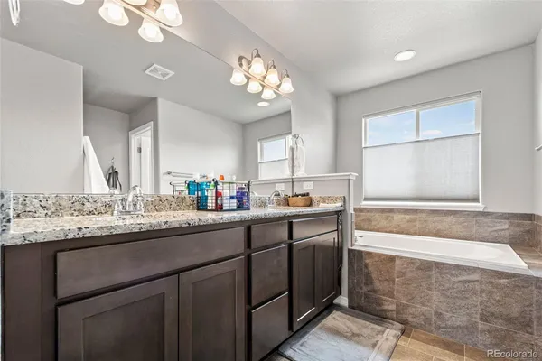 a bathroom with a shower and a glass door