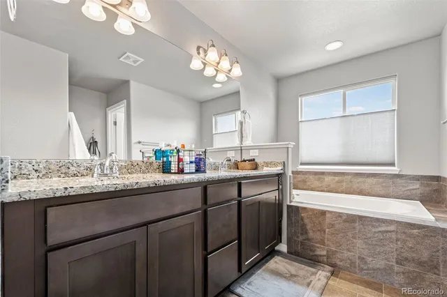 a bathroom with a shower and a glass door
