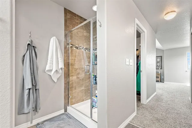 a bedroom with a bed and a tv