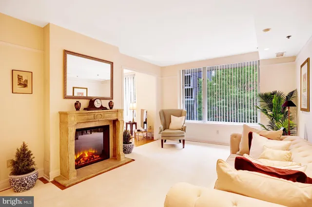 a living room with furniture and a lamp