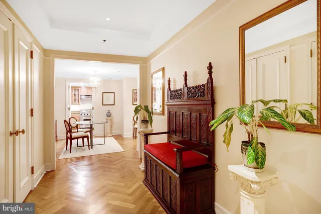 a view of a hallway with living room and furniture