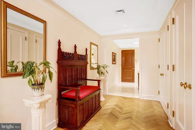 a view of a dining room with furniture and a book shelf