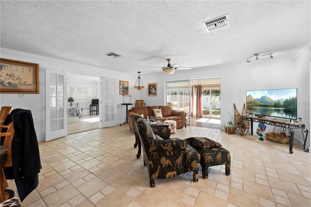 5122 Bay Boulevard Port Richey, FL 34668 - Photo 12 of 56 a living room with furniture and a flat screen tv