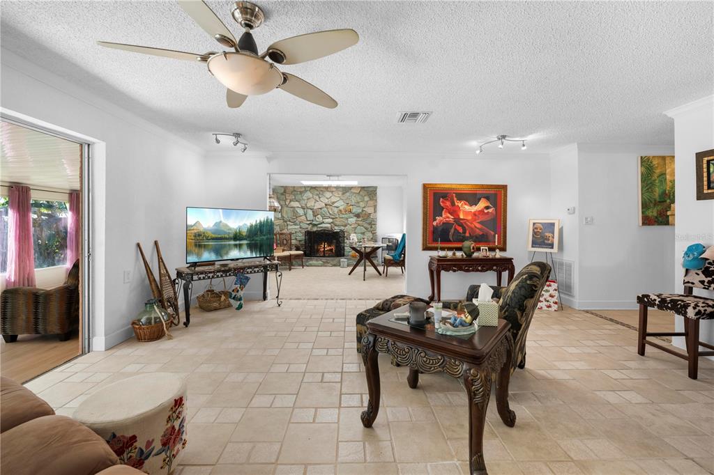 5122 Bay Boulevard Port Richey, FL 34668 - Photo 14 of 56 a living room with furniture and a flat screen tv