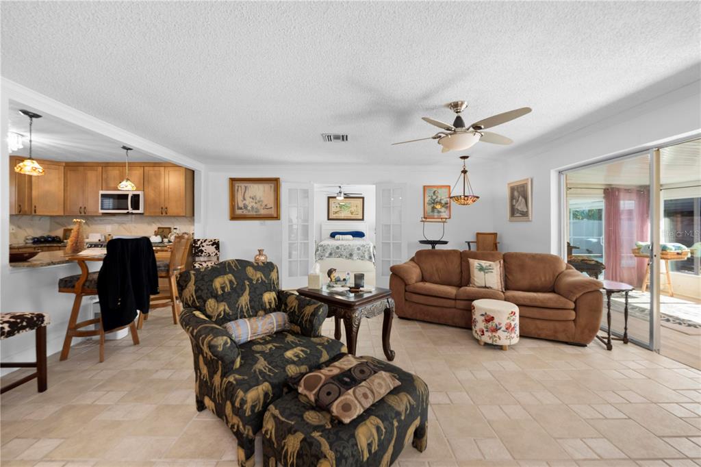 5122 Bay Boulevard Port Richey, FL 34668 - Photo 18 of 56 a living room with furniture ceiling fan and a window