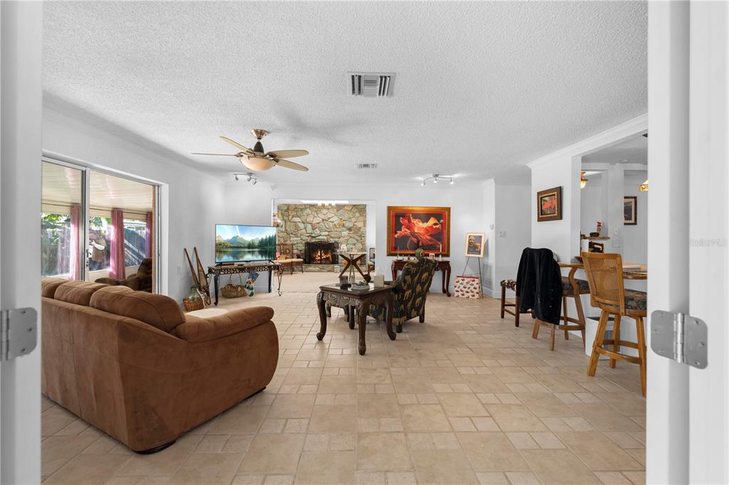 5122 Bay Boulevard Port Richey, FL 34668 - Photo 26 of 56 a living room with furniture and a flat screen tv