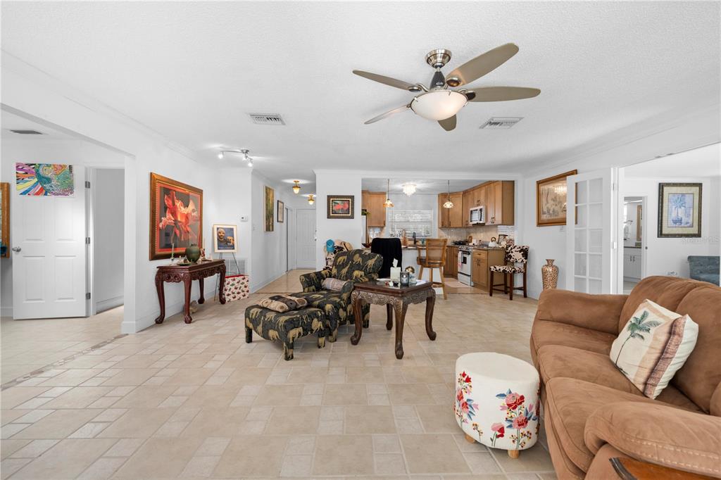 5122 Bay Boulevard Port Richey, FL 34668 - Photo 27 of 56 a living room with furniture and a ceiling fan