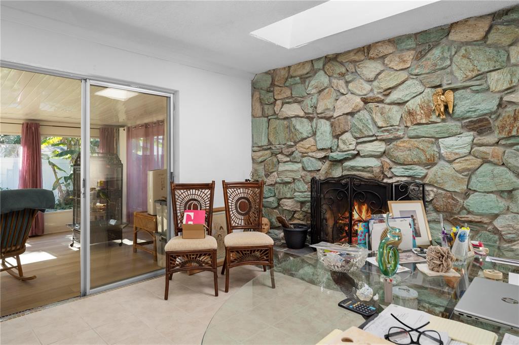 5122 Bay Boulevard Port Richey, FL 34668 - Photo 30 of 56 a living room with fireplace furniture and a fireplace