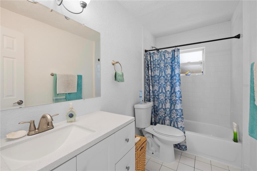 5122 Bay Boulevard Port Richey, FL 34668 - Photo 38 of 56 a bathroom with a sink toilet vanity and shower