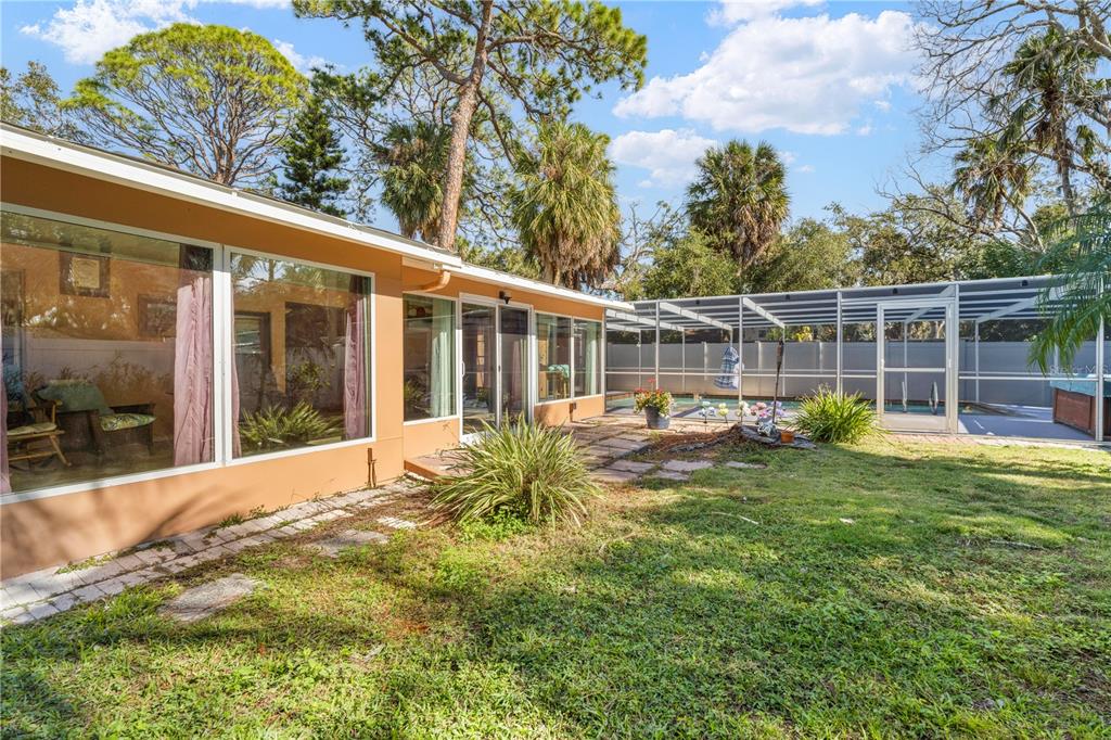 5122 Bay Boulevard Port Richey, FL 34668 - Photo 46 of 56 a view of a house with backyard and sitting area