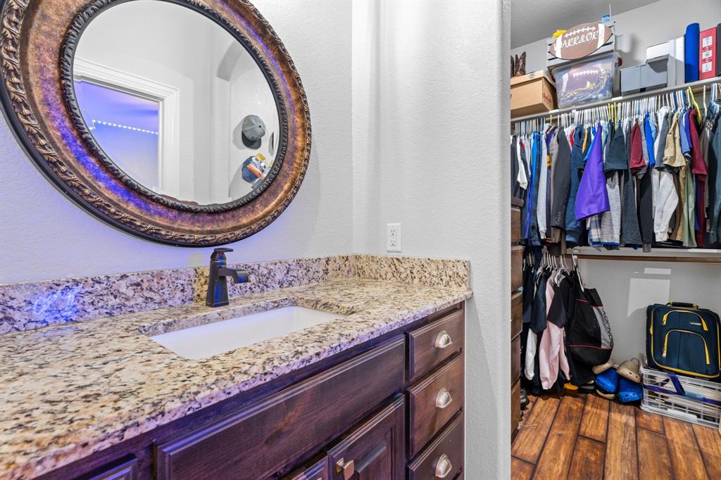 12190 Marion Road Sanger, TX 76266 - Photo 21 of 39 a bathroom with a sink and a mirror