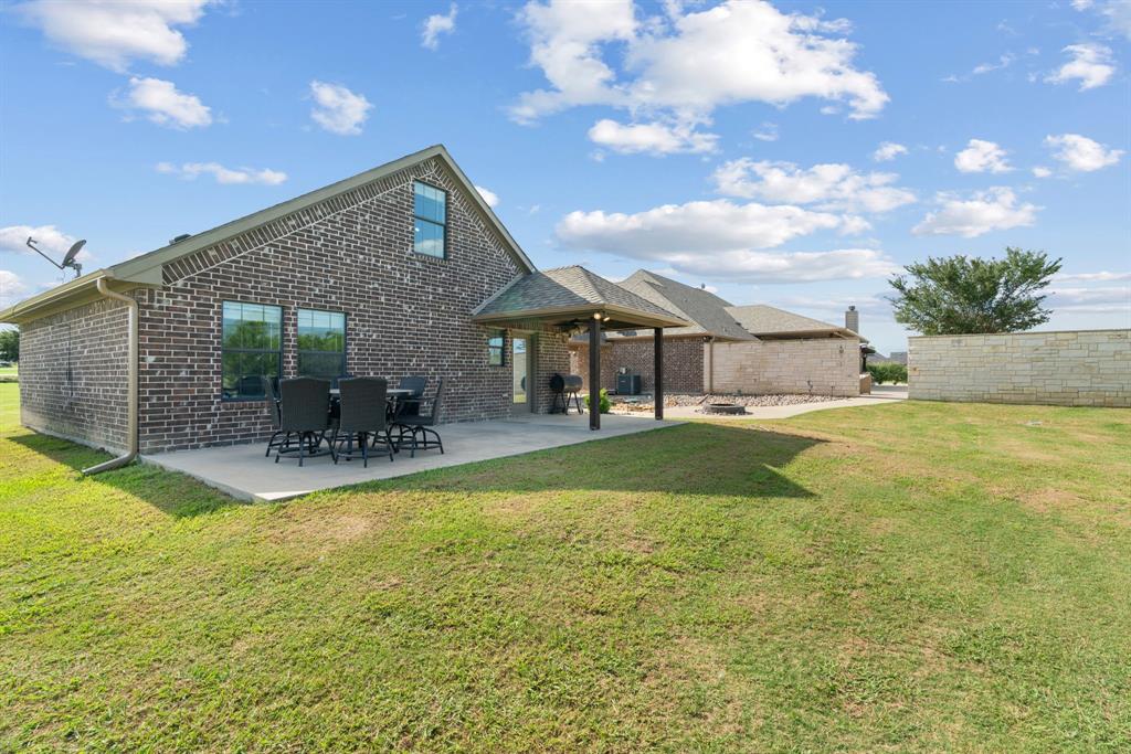 12190 Marion Road Sanger, TX 76266 - Photo 28 of 39 a view of a house with swimming pool and a yard