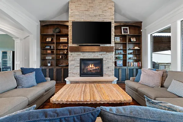 a living room with furniture ceiling fan and a rug