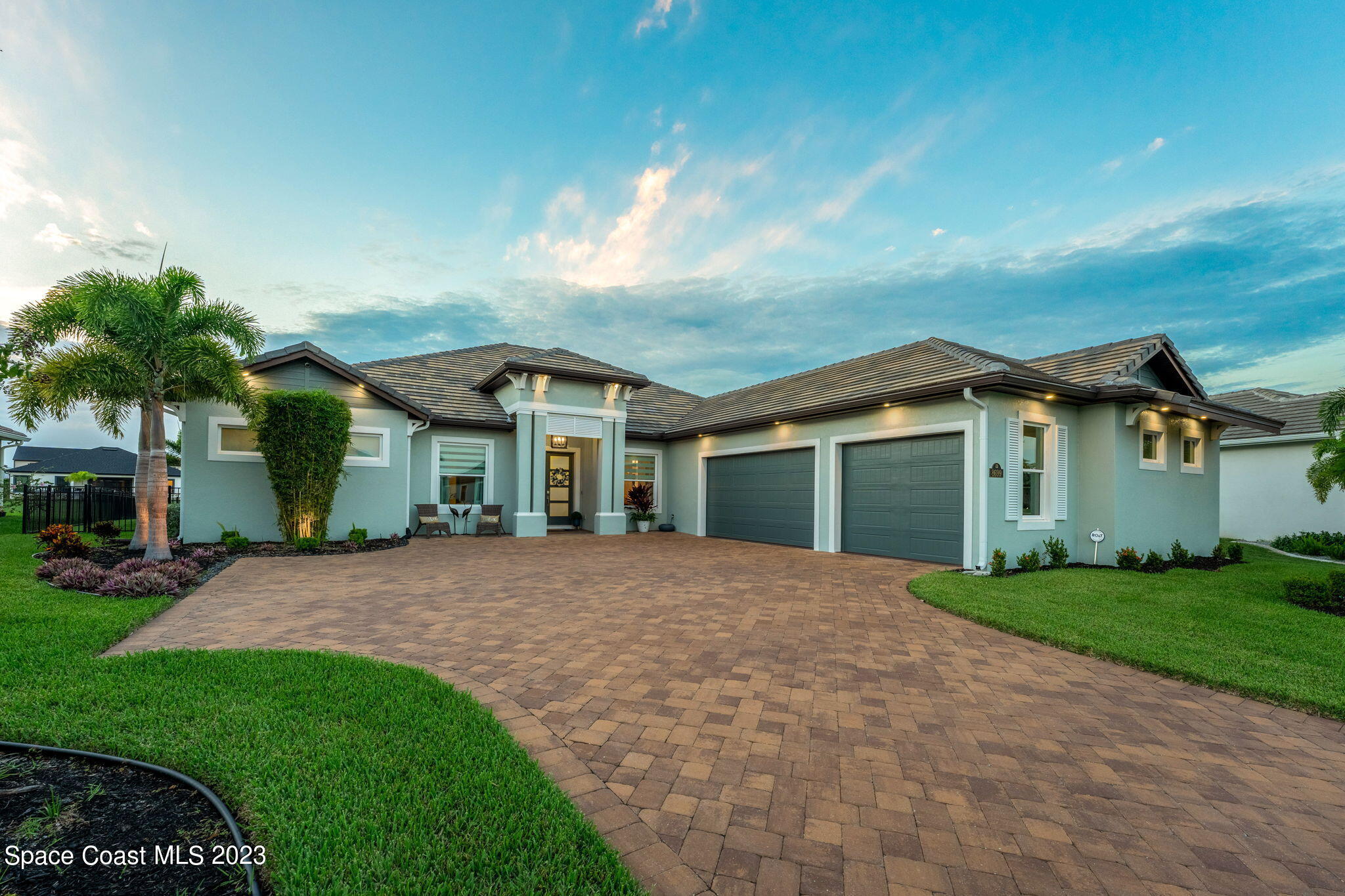 a front view of house with yard and green space