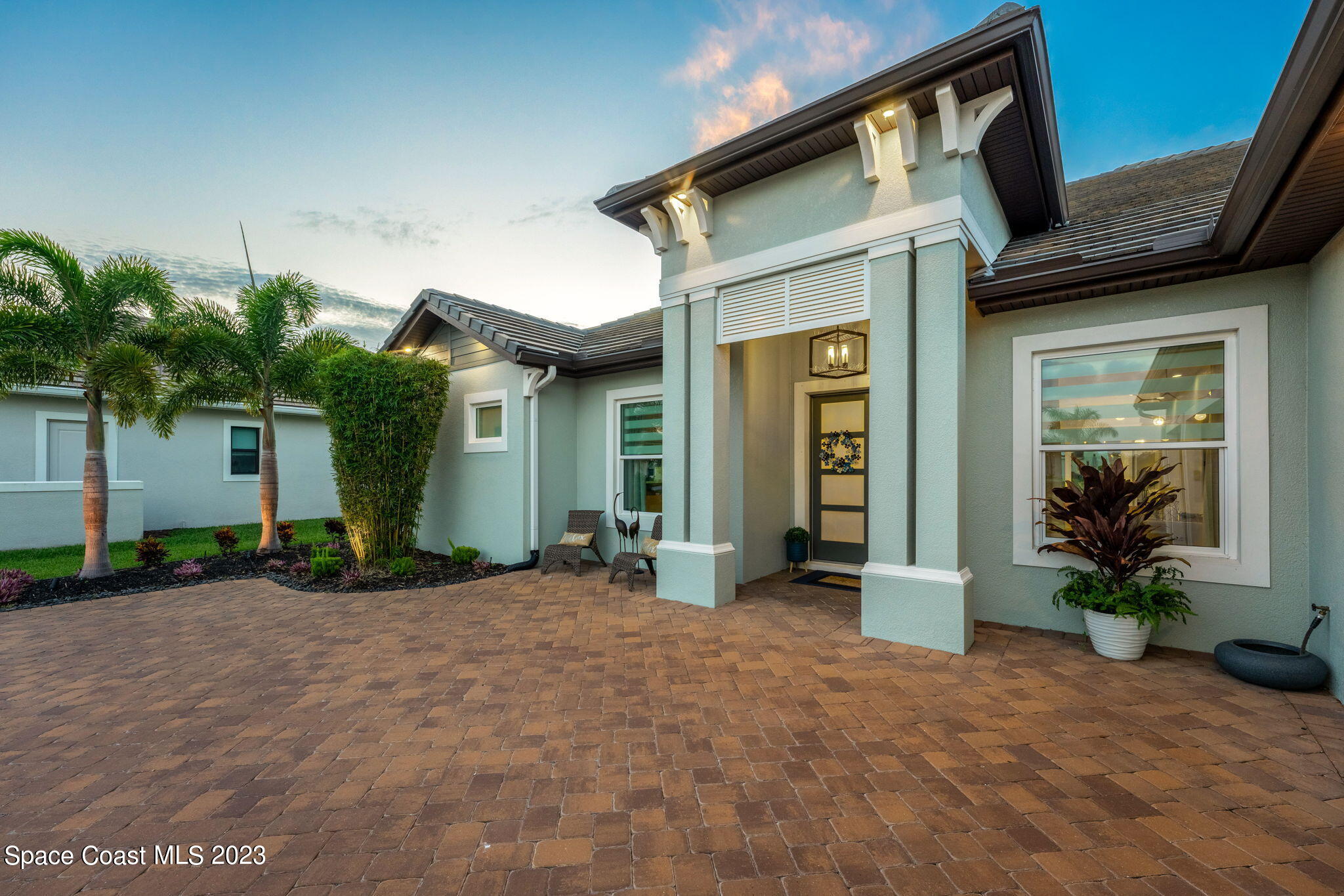 8699 Serrano Circle Melbourne, FL 32940 - Photo 2 of 31 a front view of a house with a yard