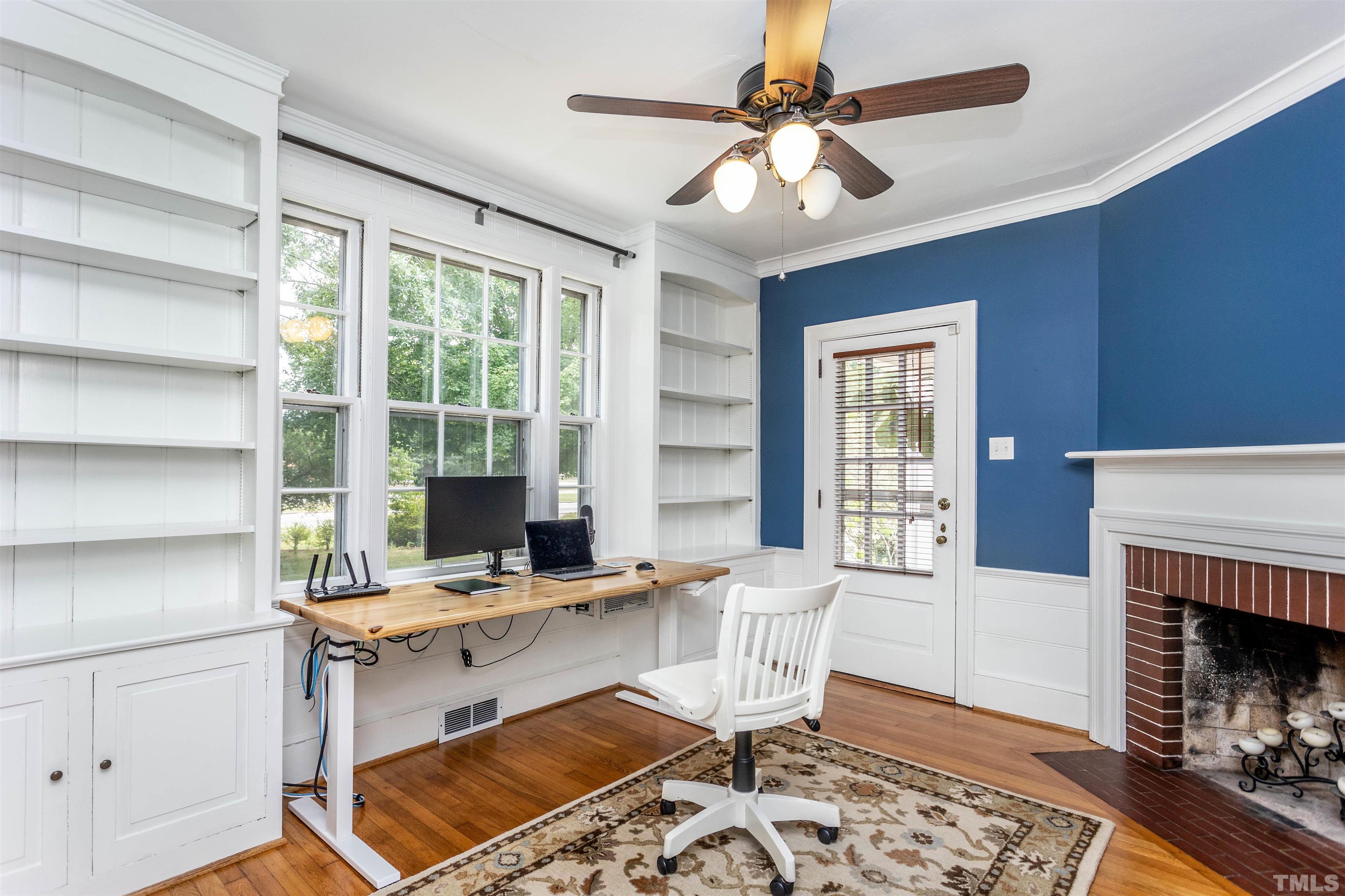 2019 New Bern Avenue Raleigh, NC 27610 - Photo 14 of 37 a workspace with a fireplace and a window