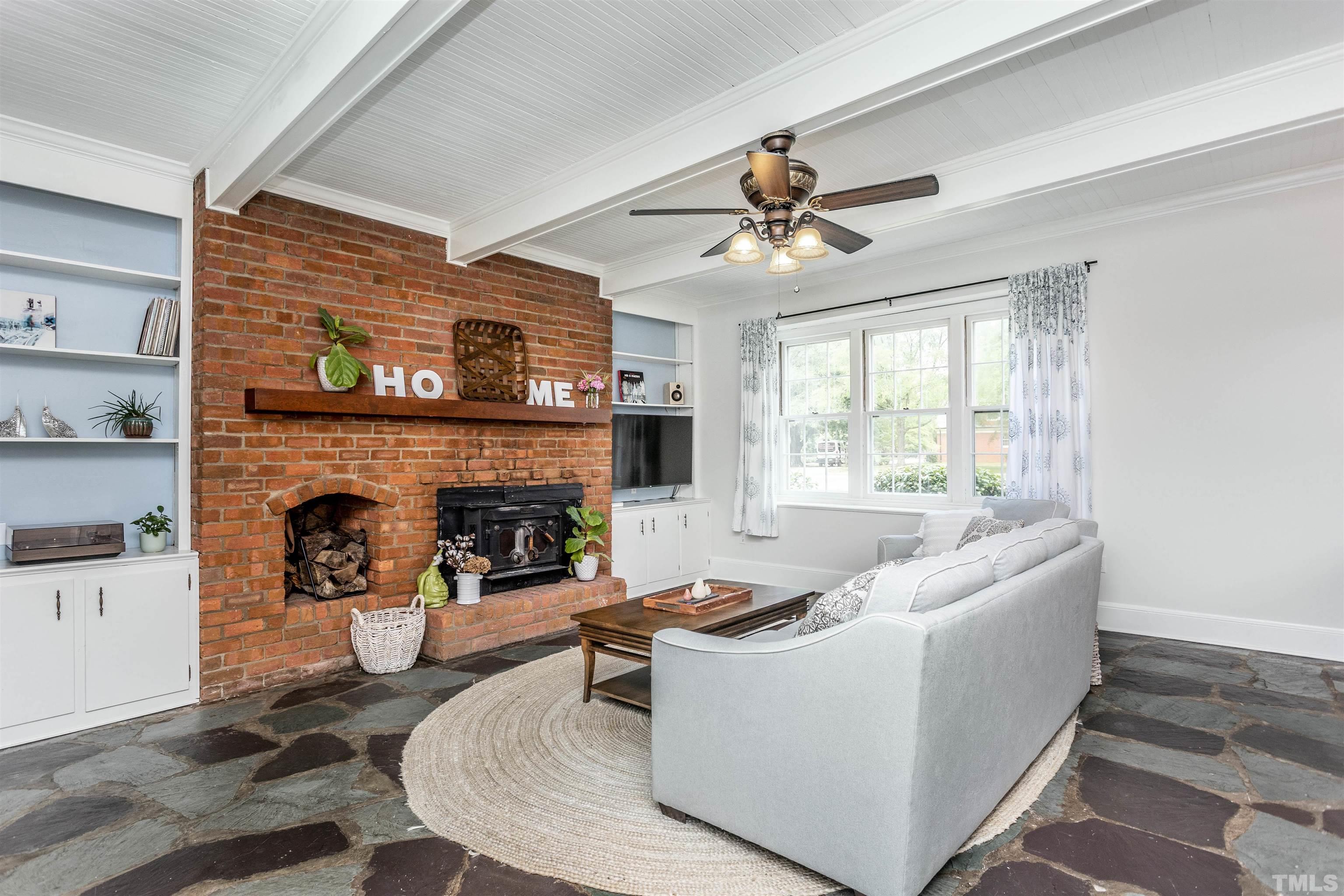 2019 New Bern Avenue Raleigh, NC 27610 - Photo 16 of 37 a living room with furniture and a fireplace