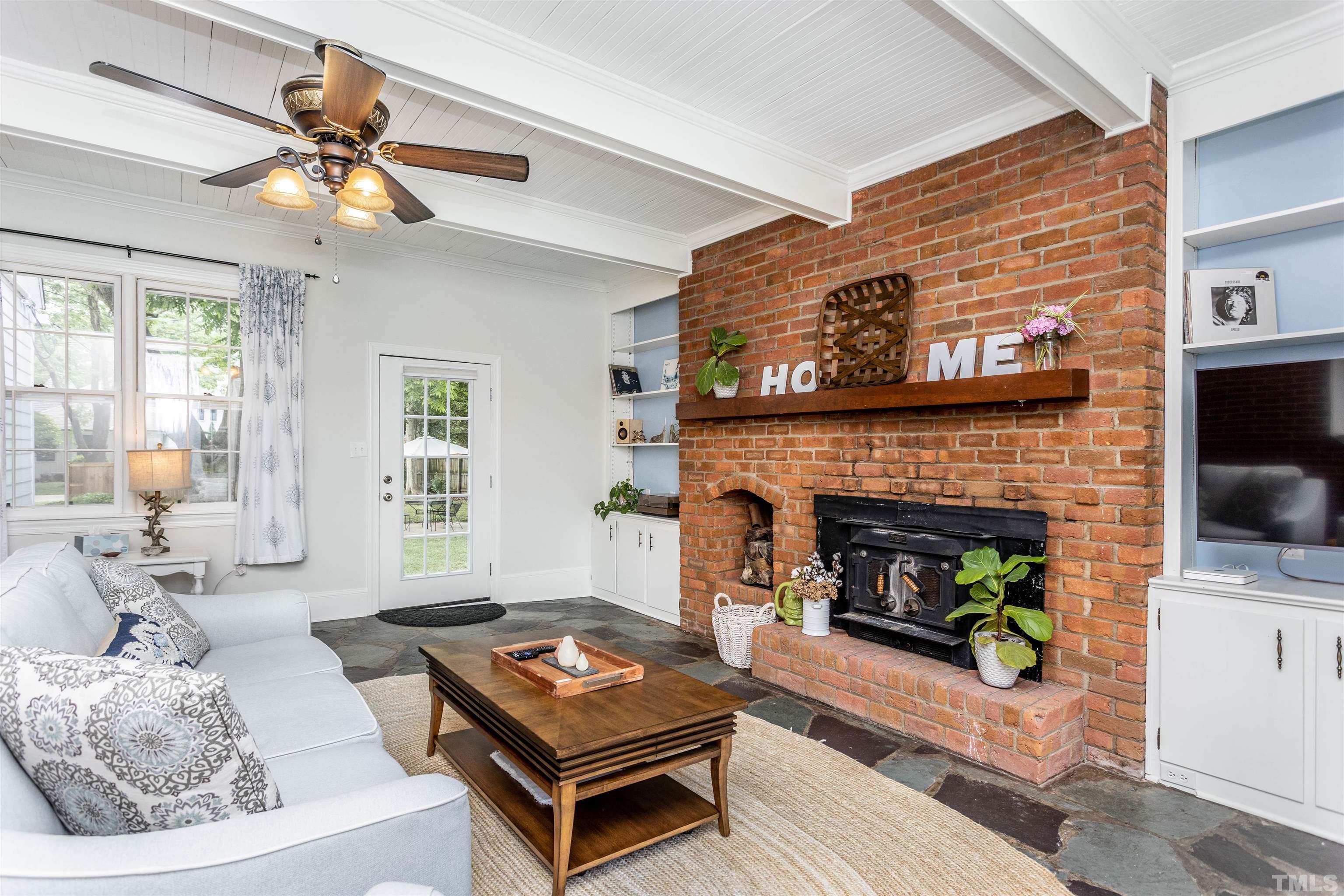 2019 New Bern Avenue Raleigh, NC 27610 - Photo 18 of 37 a living room with furniture and a fireplace