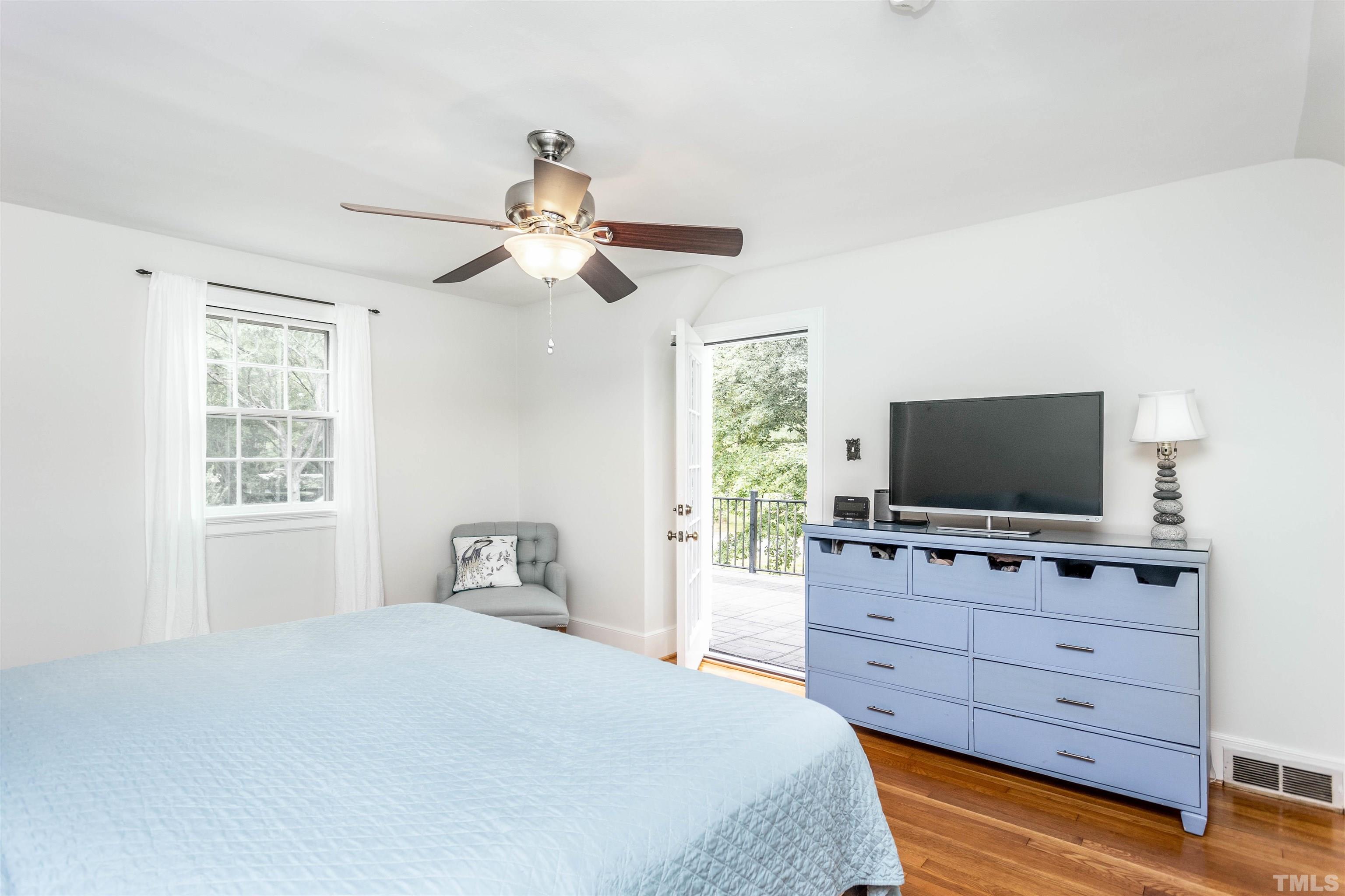 2019 New Bern Avenue Raleigh, NC 27610 - Photo 21 of 37 a bedroom with a bed and a flat screen tv
