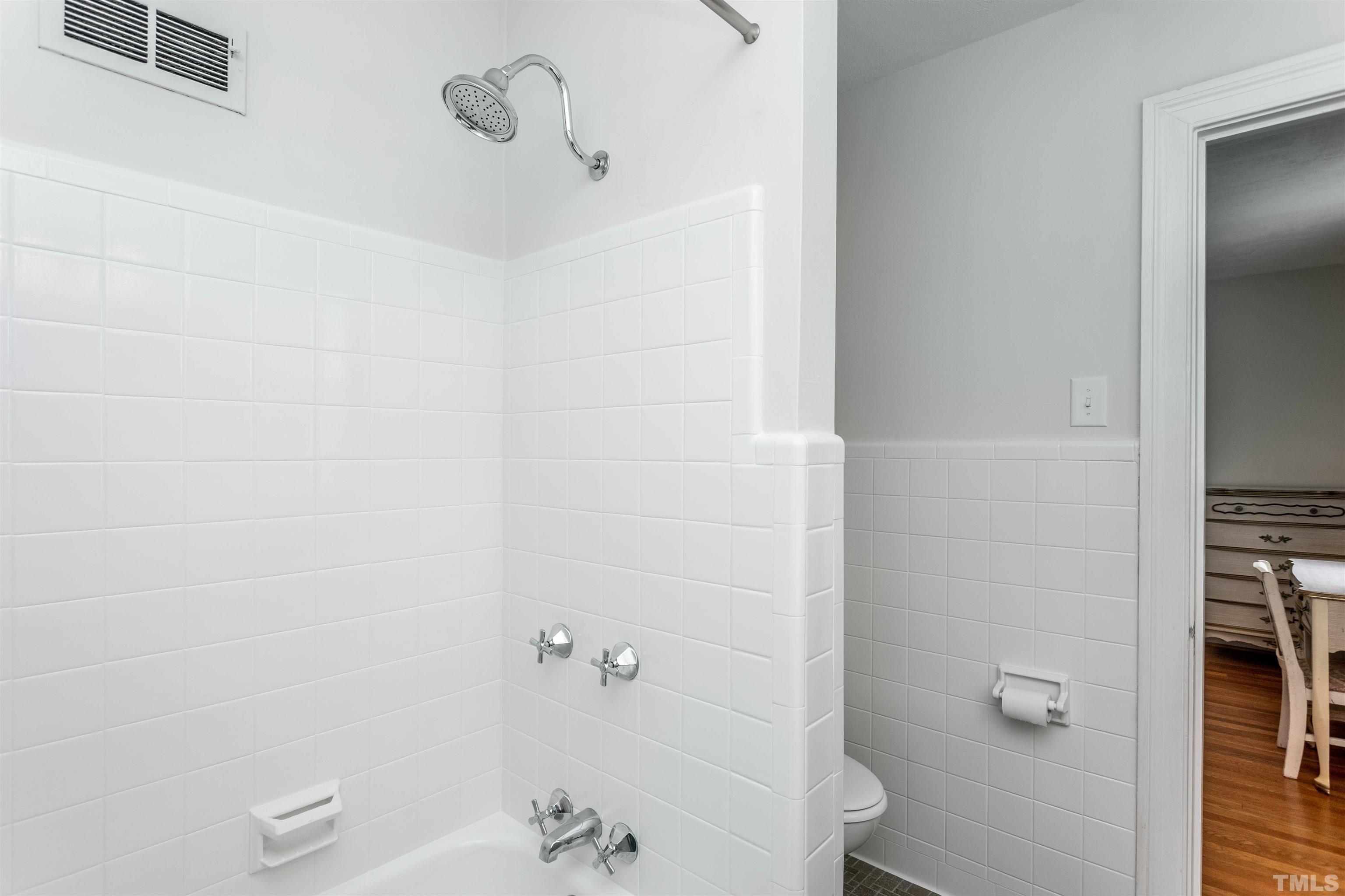 2019 New Bern Avenue Raleigh, NC 27610 - Photo 23 of 37 a bathroom with a bathtub