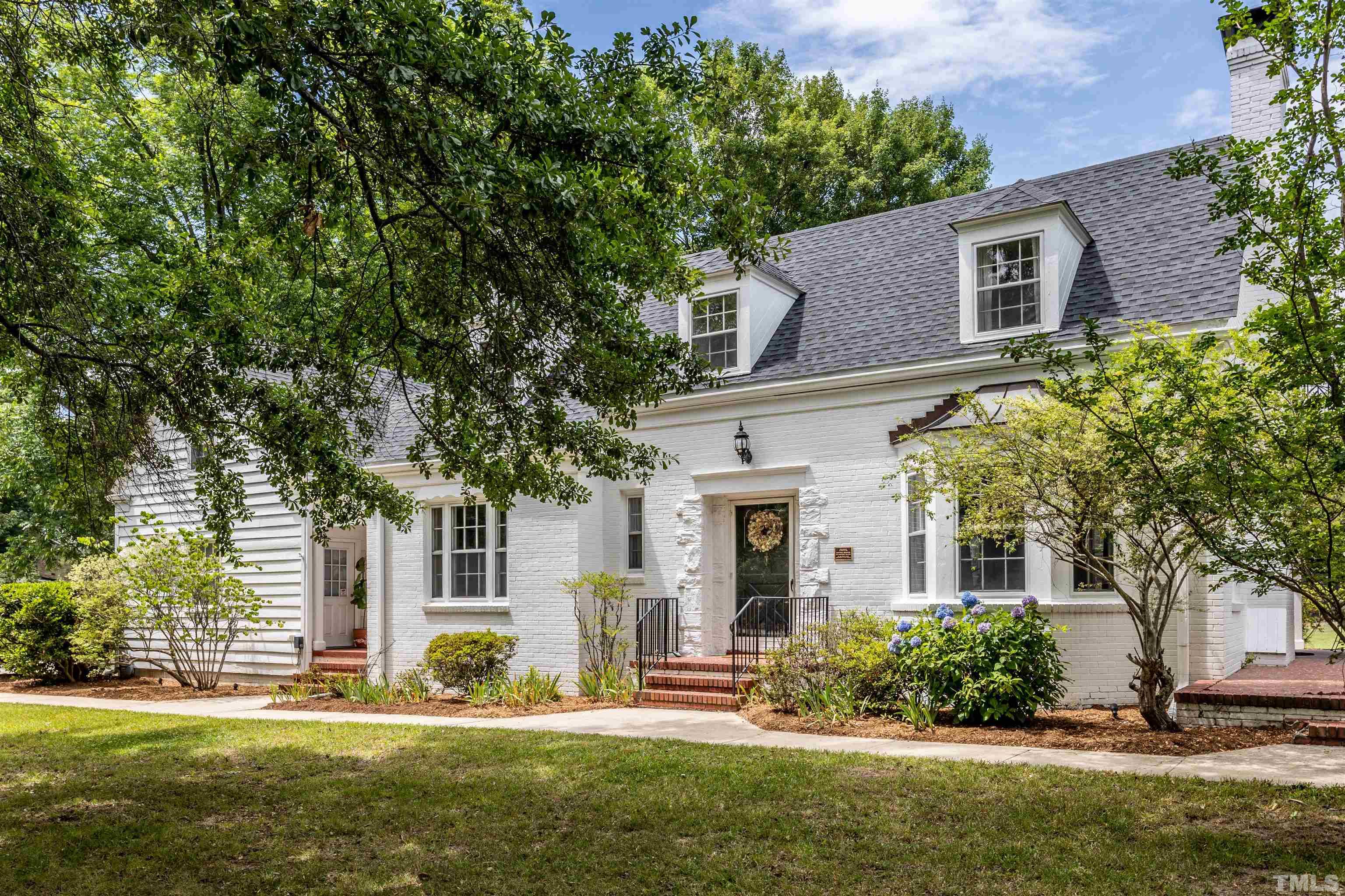 2019 New Bern Avenue Raleigh, NC 27610 - Photo 3 of 37 a front view of a house with a yard