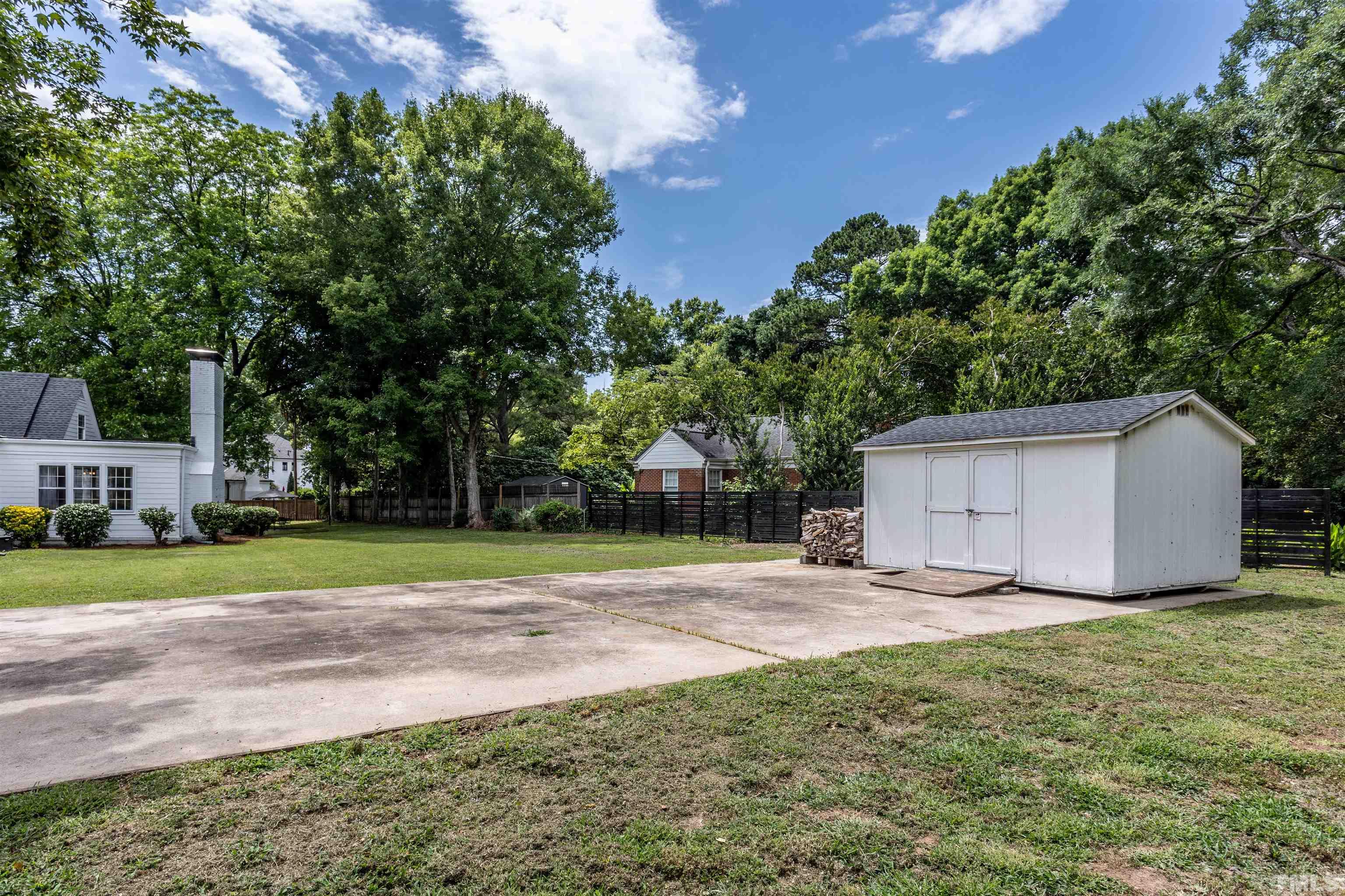 2019 New Bern Avenue Raleigh, NC 27610 - Photo 33 of 37 a view of a backyard with a garden and trees