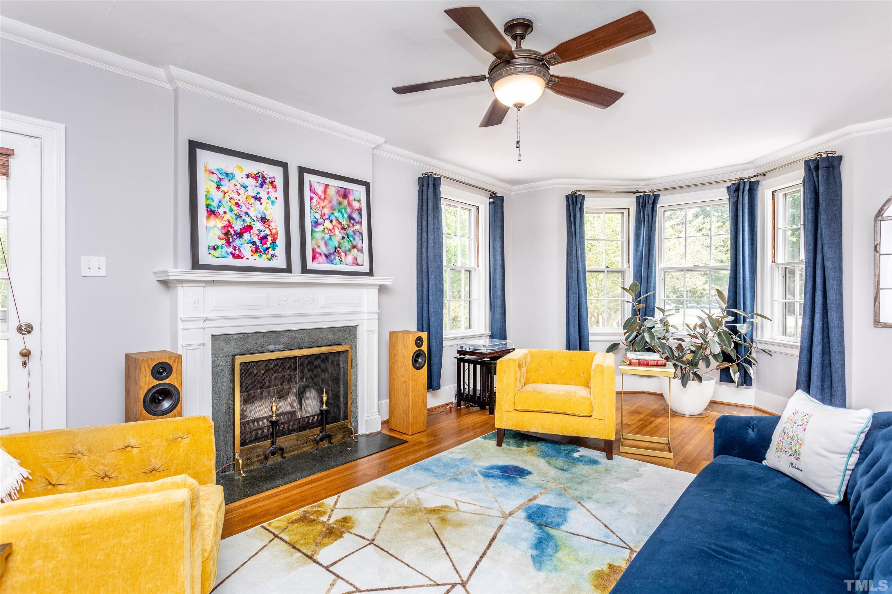 2019 New Bern Avenue Raleigh, NC 27610 - Photo 9 of 37 a living room with furniture fireplace and a large window