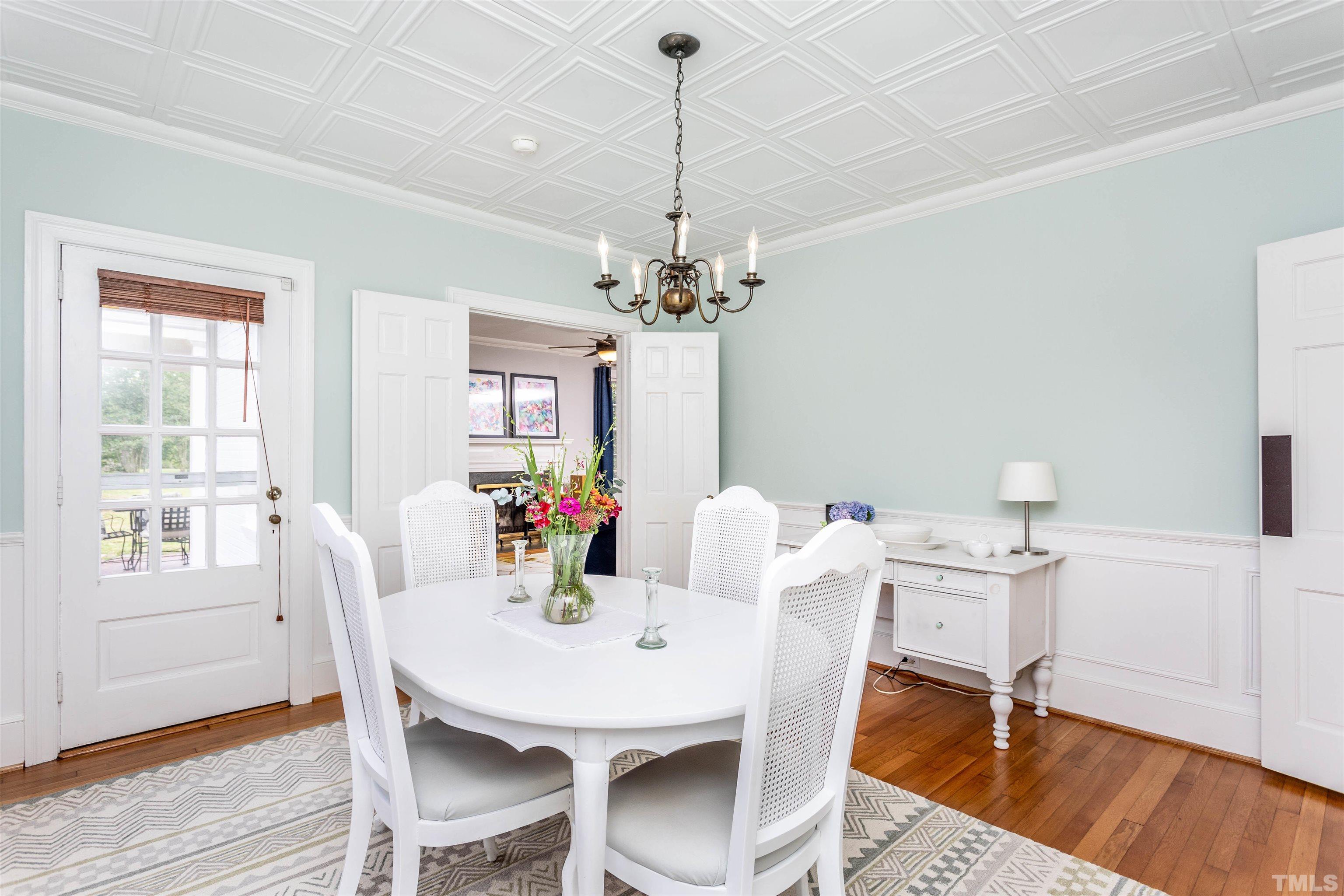 2019 New Bern Avenue Raleigh, NC 27610 - Photo 10 of 37 a view of a dining room with furniture wooden floor and chandelier