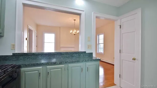 a kitchen with granite countertop a sink and a window