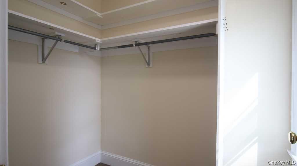 40 Broad Street Fishkill, NY 12524 - Photo 16 of 23 a view of walk in closet with empty racks