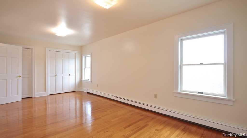 40 Broad Street Fishkill, NY 12524 - Photo 18 of 23 a view of an empty room with wooden floor and a window