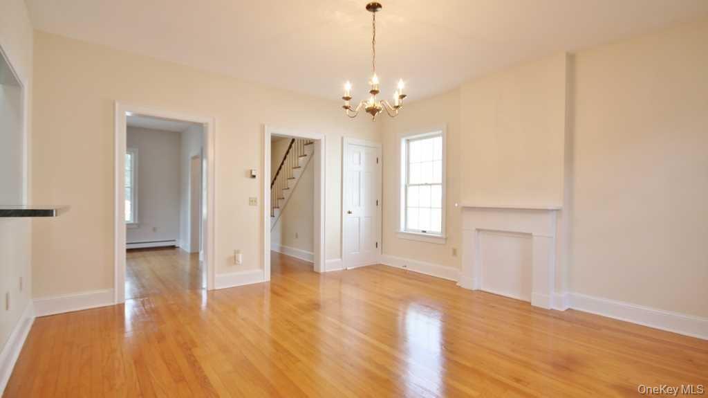 40 Broad Street Fishkill, NY 12524 - Photo 9 of 23 a view of an empty room with window and wooden floor
