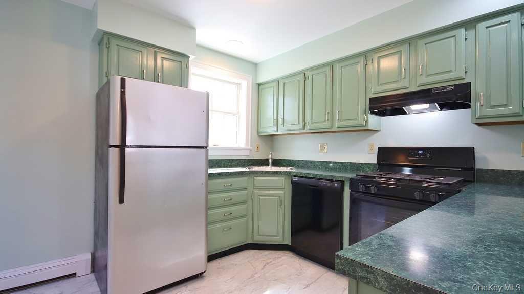 40 Broad Street Fishkill, NY 12524 - Photo 10 of 23 a kitchen with a refrigerator stove and sink