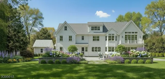 a front view of a house with a garden and plants