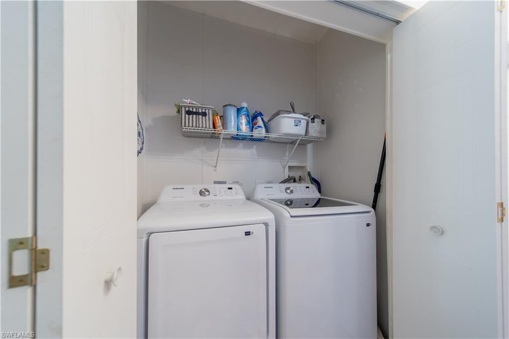 433 Riviera Boulevard West Naples, FL 34112 - Photo 10 of 30 a utility room with dryer and washer