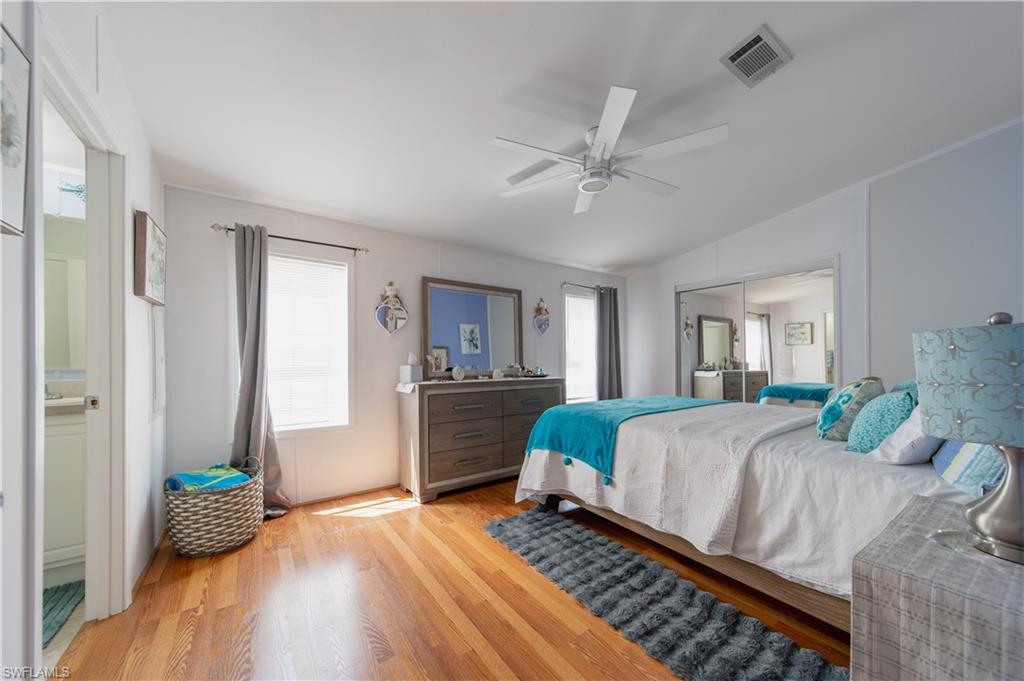 433 Riviera Boulevard West Naples, FL 34112 - Photo 13 of 30 a living room with a bed furniture and a window