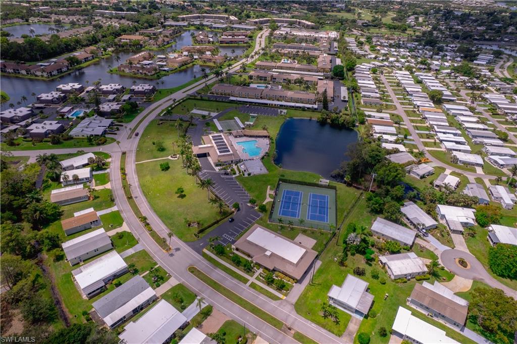 433 Riviera Boulevard West Naples, FL 34112 - Photo 28 of 30 an aerial view of a house with a swimming pool outdoor seating and yard