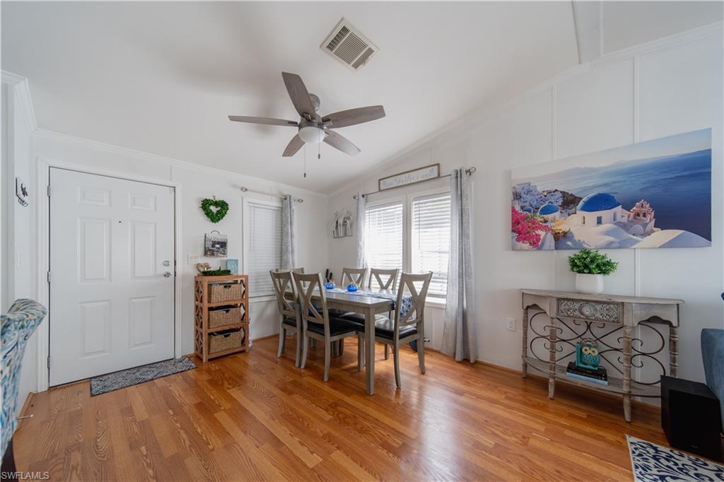 433 Riviera Boulevard West Naples, FL 34112 - Photo 4 of 30 a view of a livingroom with furniture and wooden floor