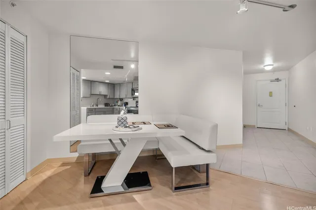 a view of kitchen with cabinets and wooden floor