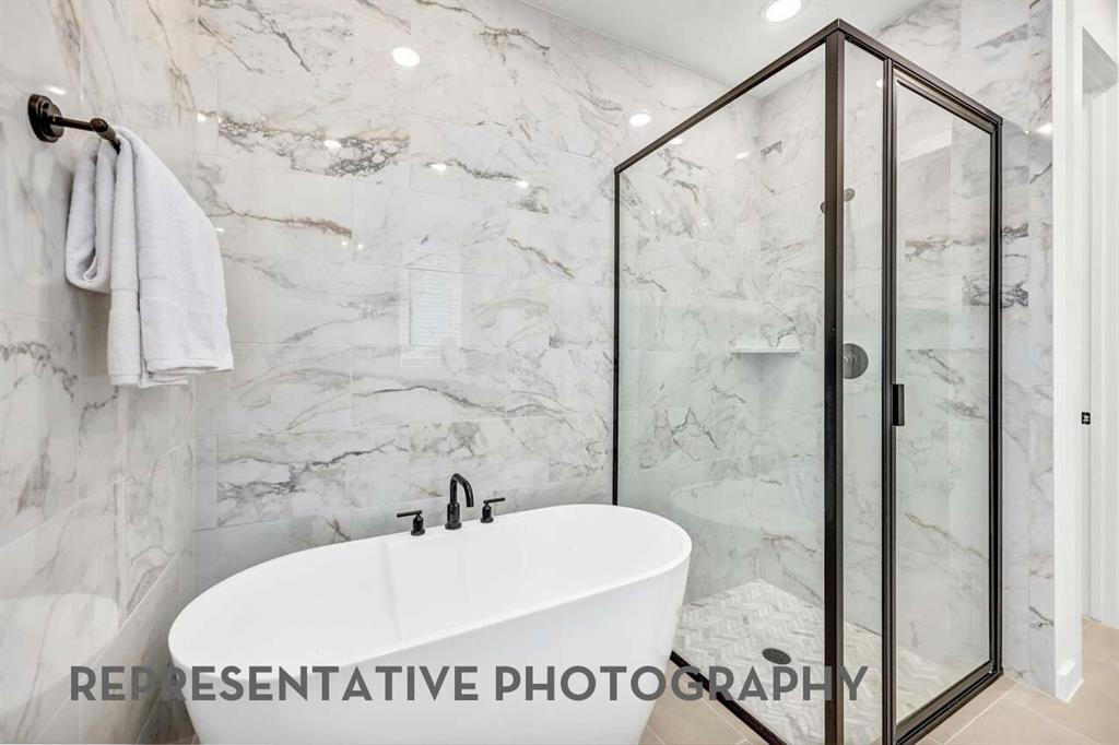 8715 Wildberry Road Oak Point, TX 75068 - Photo 12 of 23 a bathroom with a bathtub and shower
